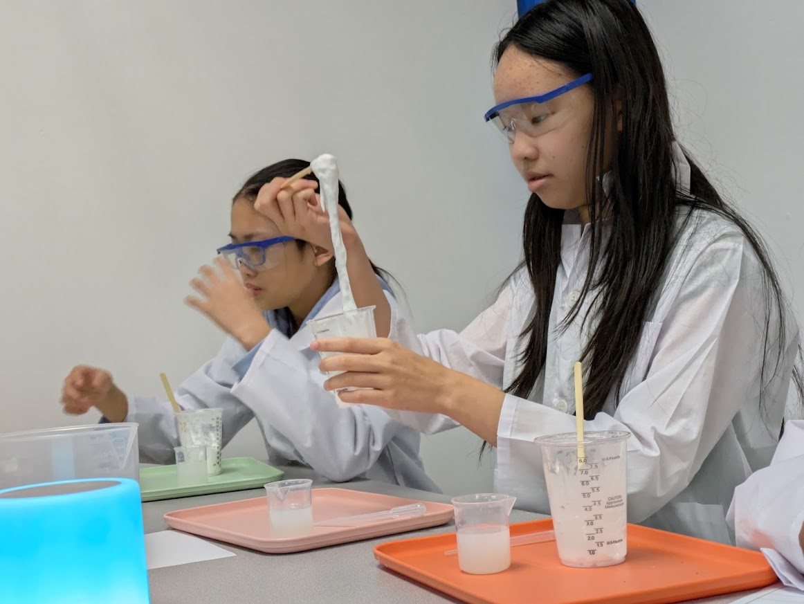 Student stretching a polymer during chemistry